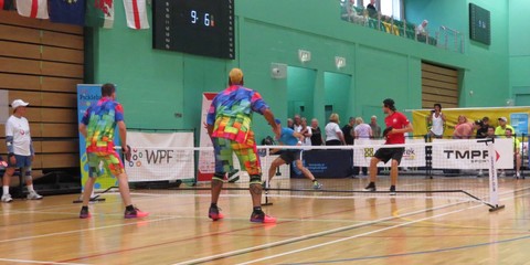 Pickleball players playing in a doubles match